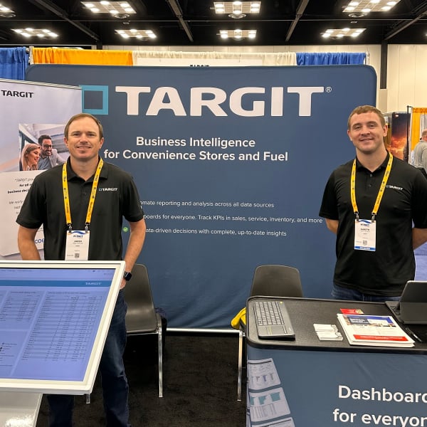 TARGIT Team in front of booth at M-PACT Event